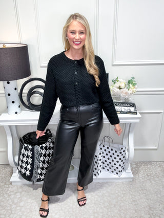 Cozy chunky knit button front chic cardigan top and high waisted luxe faux leather pants with wide leg