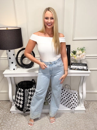Light wash denim jeans with pearl details