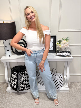 Light wash denim jeans with pearl details