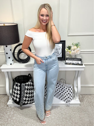 Light wash denim jeans with pearl details