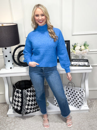 blue chunky knit turtleneck sweater