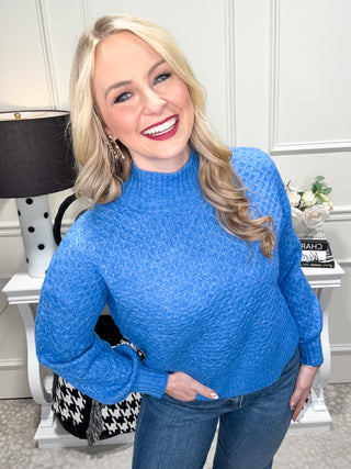 blue chunky knit turtleneck sweater