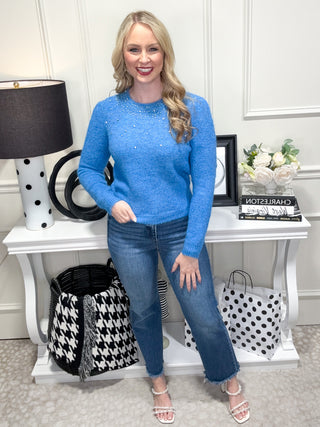 blue knit sweater with rhinestone details