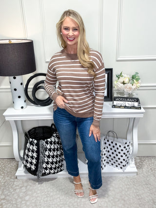 Classic crewneck sweater with neutral stripes